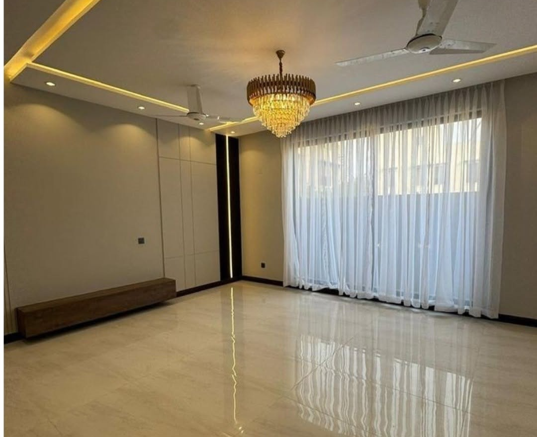 Living hall with cove lighting and chandelier